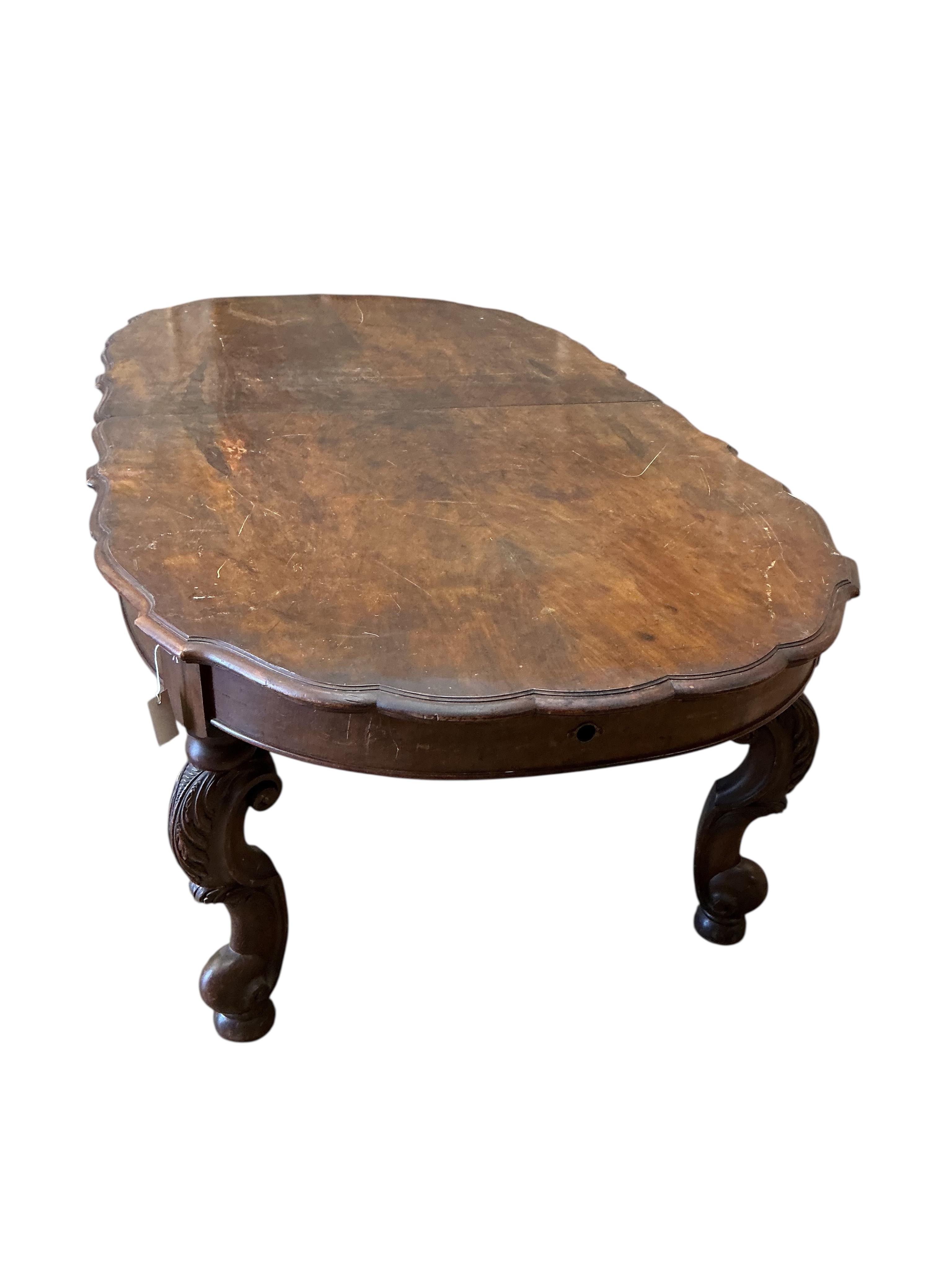 A late 19th century Continental walnut extending dining table, 264cm extended, one spare leaf, depth 114cm, height 73cm